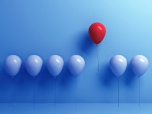 blue and red balloons illustrating idea and unique one